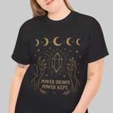 Person wearing a black t-shirt with a gold design on a white background