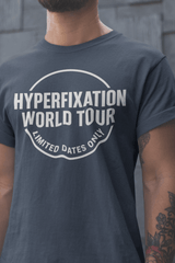 Funny ADHD graphic t-shirt with 'Hyperfixation World Tour' design in bold font.