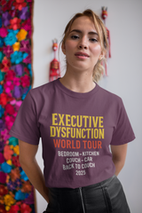 Unisex Executive Dysfunction T-Shirt featuring 'World Tour' design with humorous couch journey phrase.
