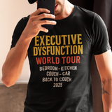 Person wearing a black t-shirt with 'Executive Dysfunction World Tour' graphic design, humor about daily life.