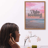 Woman contemplating beside a calming beach-themed print with the message 'This feeling is temporary'.