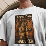 Person wearing a t-shirt with a graphic design of a lion and text, standing in front of an architectural background.