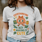 Person wearing a t-shirt with a cartoon character and text in a field