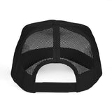 Back view of a black foam trucker hat showcasing mesh paneling and adjustable strap.