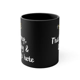 Black mug with white text on a white background