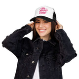 Young woman wearing a stylish Too Much Good Foam Trucker Hat with a playful design, perfect for summer outings.