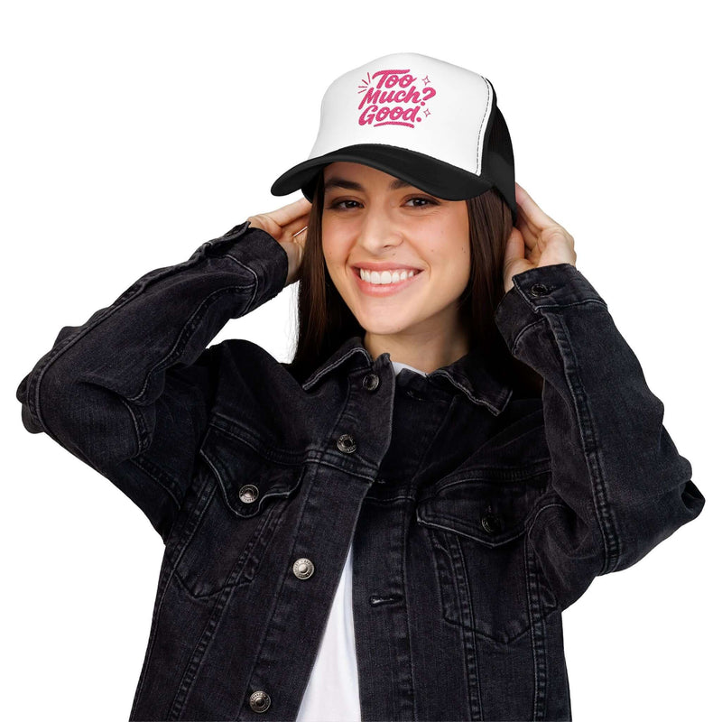 Young woman wearing a stylish Too Much Good Foam Trucker Hat with a playful design, perfect for summer outings.