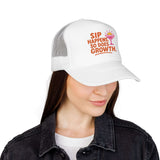 Woman wearing a Sip Happens Foam Trucker Hat with vibrant embroidered design for summer style.