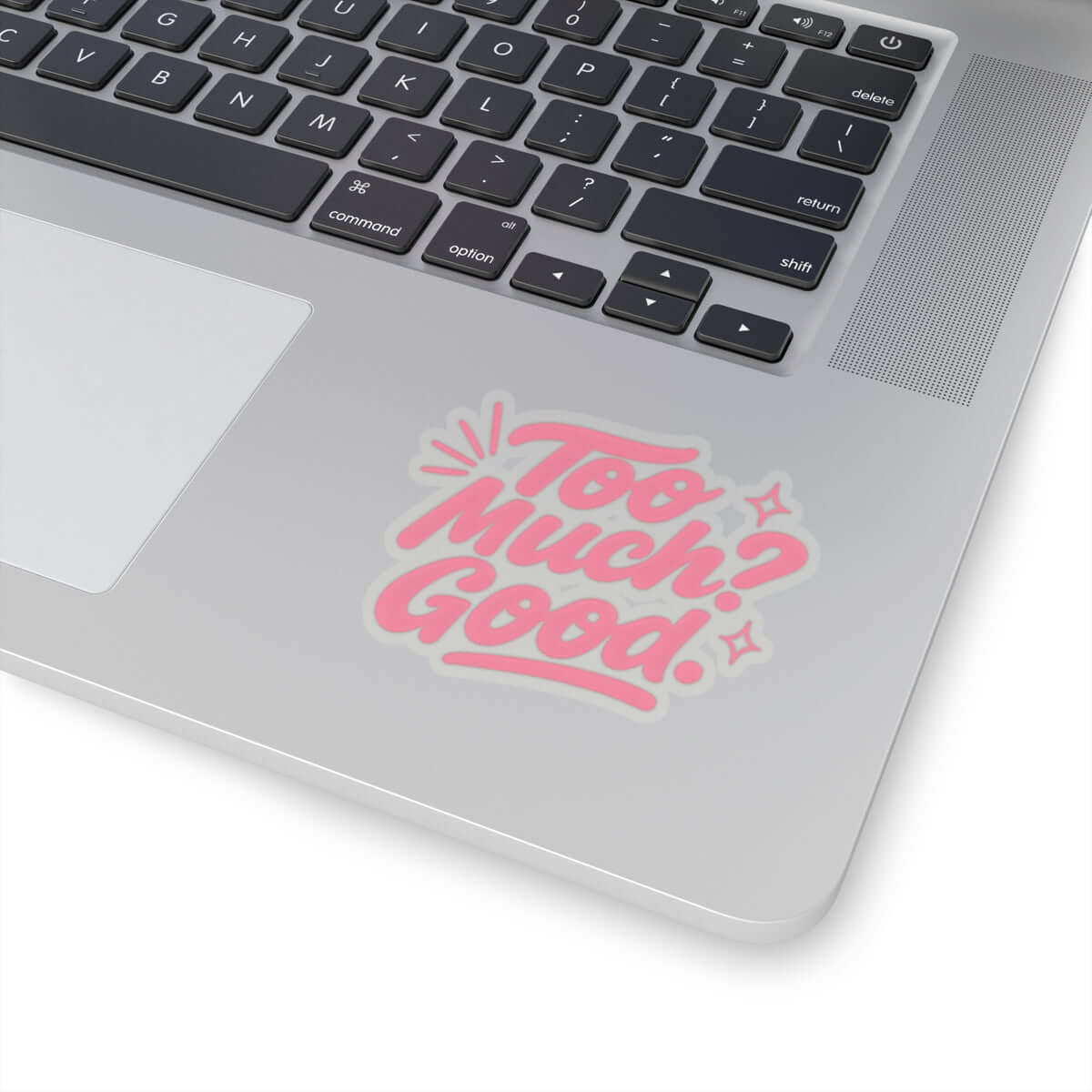 Glossy laptop decal sticker with the phrase 'Too Much? Good!' in playful pink font.