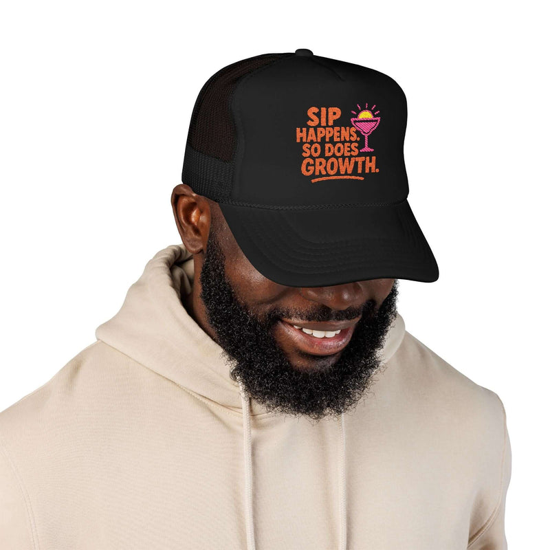 Man wearing a black Foam Trucker Hat with "Sip Happens, So Does Growth" embroidered design.