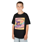Smiling boy wearing a black Kids Magical Kindness Tee with 'Kindness is My Magic Power' design.
