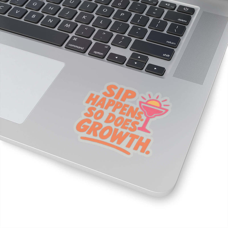 Colorful 'Sip Happens, So Does Growth' sticker on a silver laptop for fun decor and motivation.