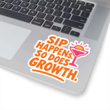 Colorful sticker on laptop reads 'Sip Happens, So Does Growth' enhancing fun and positivity.