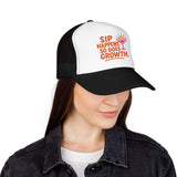 Woman wearing a fun Sip Happens Foam Trucker Hat with vibrant embroidery for summer style.