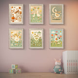 Charming farm animal nursery wall art set featuring watercolor goose prints in soft frames, ideal for baby room decor.