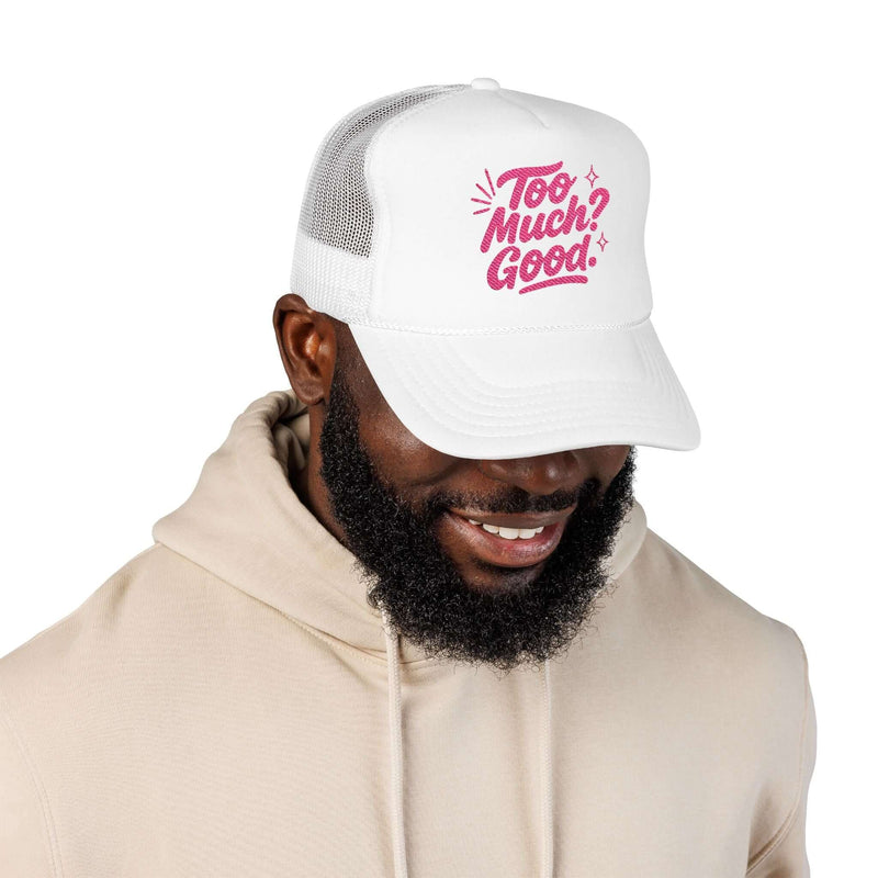 Man wearing a Too Much Good Trucker Hat with embroidered fun design, perfect for summer outings.