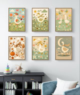 Farm animal nursery wall art set featuring colorful watercolor geese in floral scenes, perfect for baby room decor.