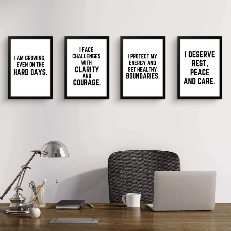Four motivational wall art prints with empowering quotes for confidence and self-care in a modern office setting.
