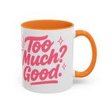 Colorful coffee mug with pink text "Too Much? Good." and orange handle, perfect for bright mornings and gifts.