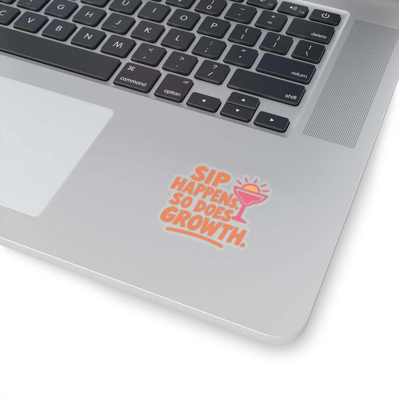 Colorful 'Sip Happens So Does Growth' sticker on a laptop, adding fun decor and positivity to tech.