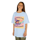 Girl wearing a light blue cotton tee that says 'Kindness is My Magic Power' featuring a whimsical design for encouraging positivity.