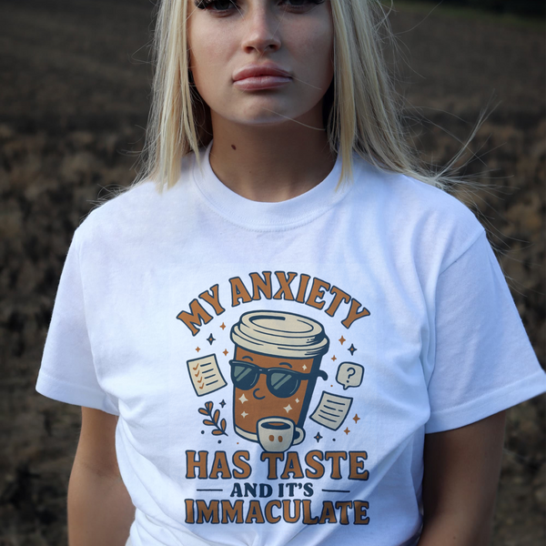 Person wearing a white t-shirt with a graphic design and text.