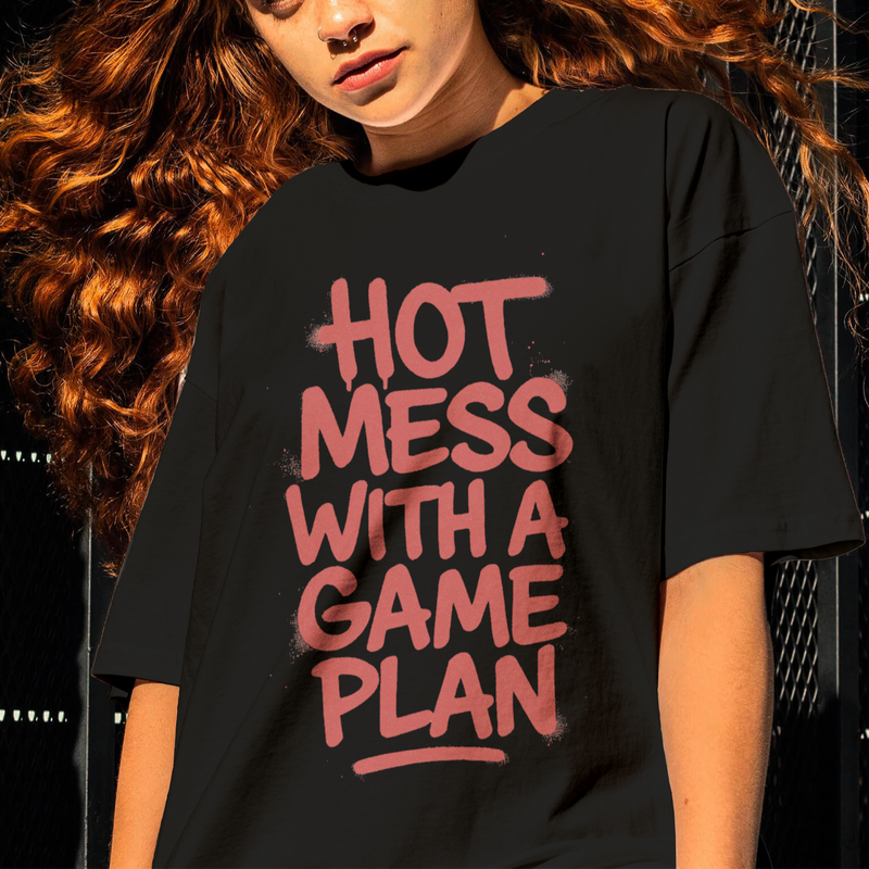 Person wearing a black t-shirt with red text against a dark background