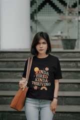 Unisex Retro Graphic Tee – ‘Kinda Tired Kinda Thriving’