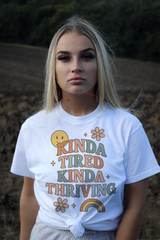 Unisex Retro Graphic Tee – ‘Kinda Tired Kinda Thriving’