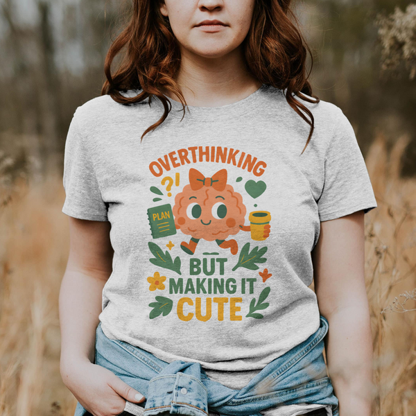 Person wearing a t-shirt with a cartoon character and text in a field
