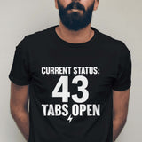 Man wearing a black t-shirt with 'CURRENT STATUS: 43 Tabs Open' text against a plain background