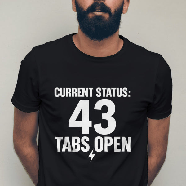 Man wearing a black t-shirt with 'CURRENT STATUS: 43 Tabs Open' text against a plain background