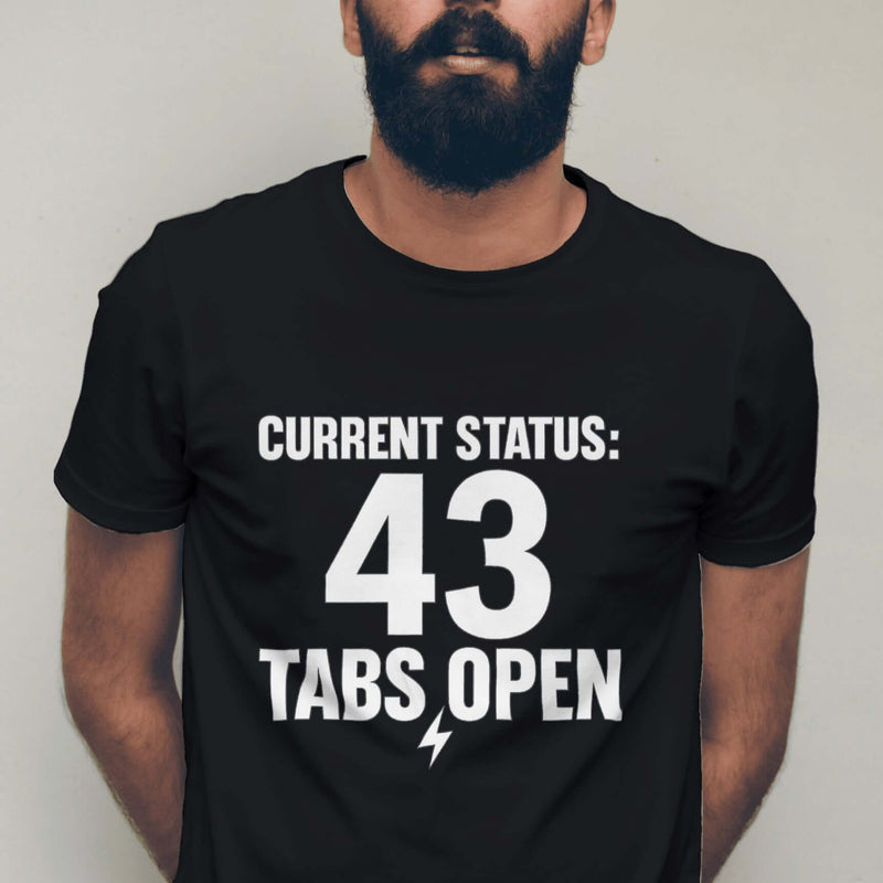 Man wearing a black t-shirt with 'CURRENT STATUS: 43 Tabs Open' text against a plain background