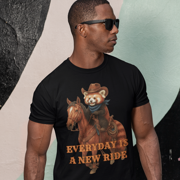 Man wearing a black t-shirt with a graphic of a bear riding a horse and text 'Everyday is a New Ride' against a colorful background.